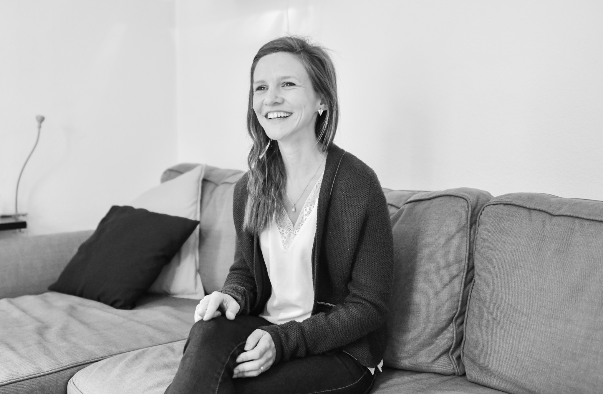 Anne-Catherine sitting on sofa